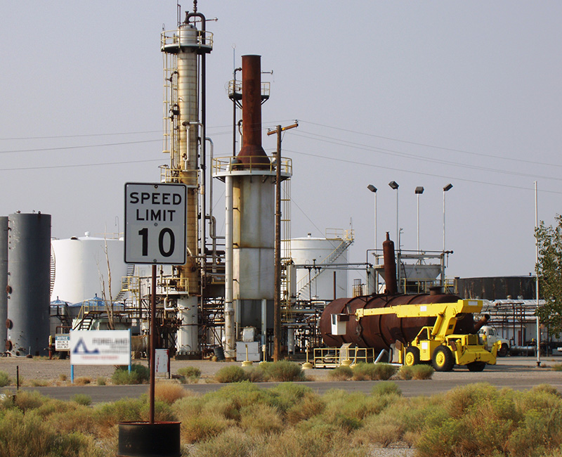 An industrial plant with towers, tanks, and heavy equipment