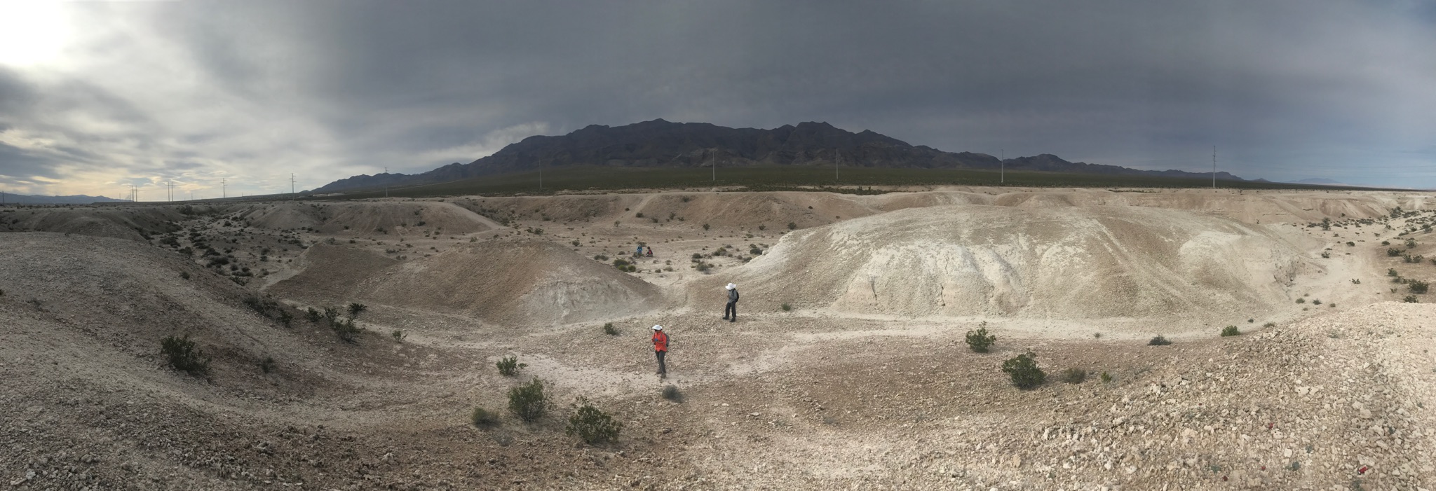 Desert landscape Ice Age Fossils State Park, field biologist at work with grey sky 